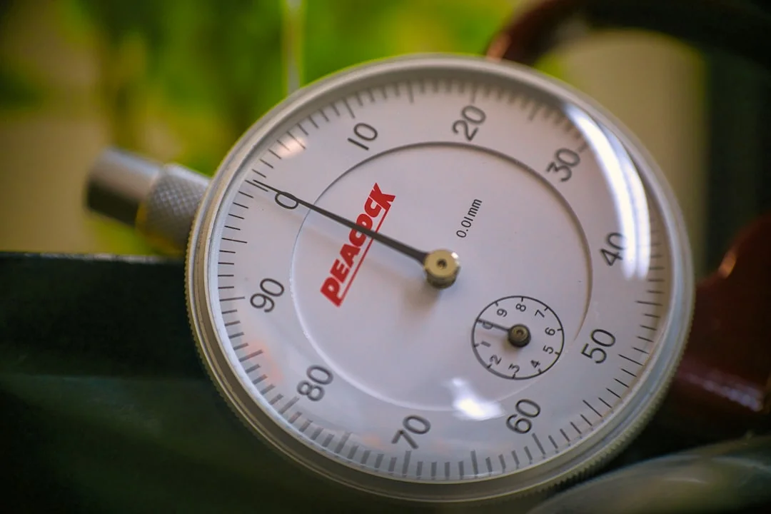 silver round analog watch at 10