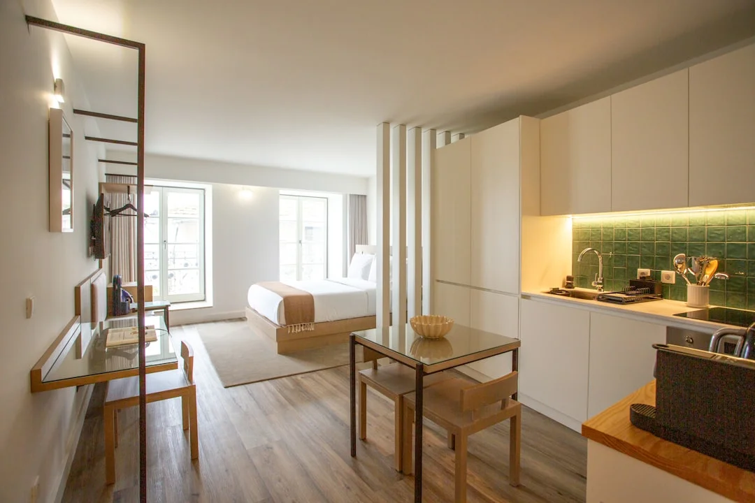 a kitchen with a table and chairs in it