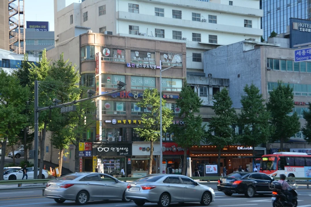 a street with cars and buildings