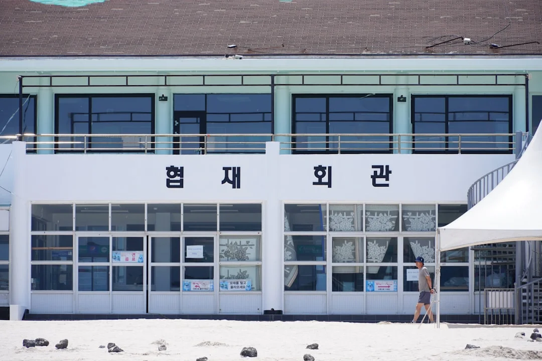 A building with korean text and glass windows.