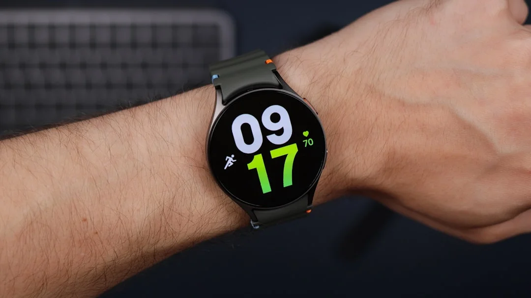 A close up of a person wearing a smart watch