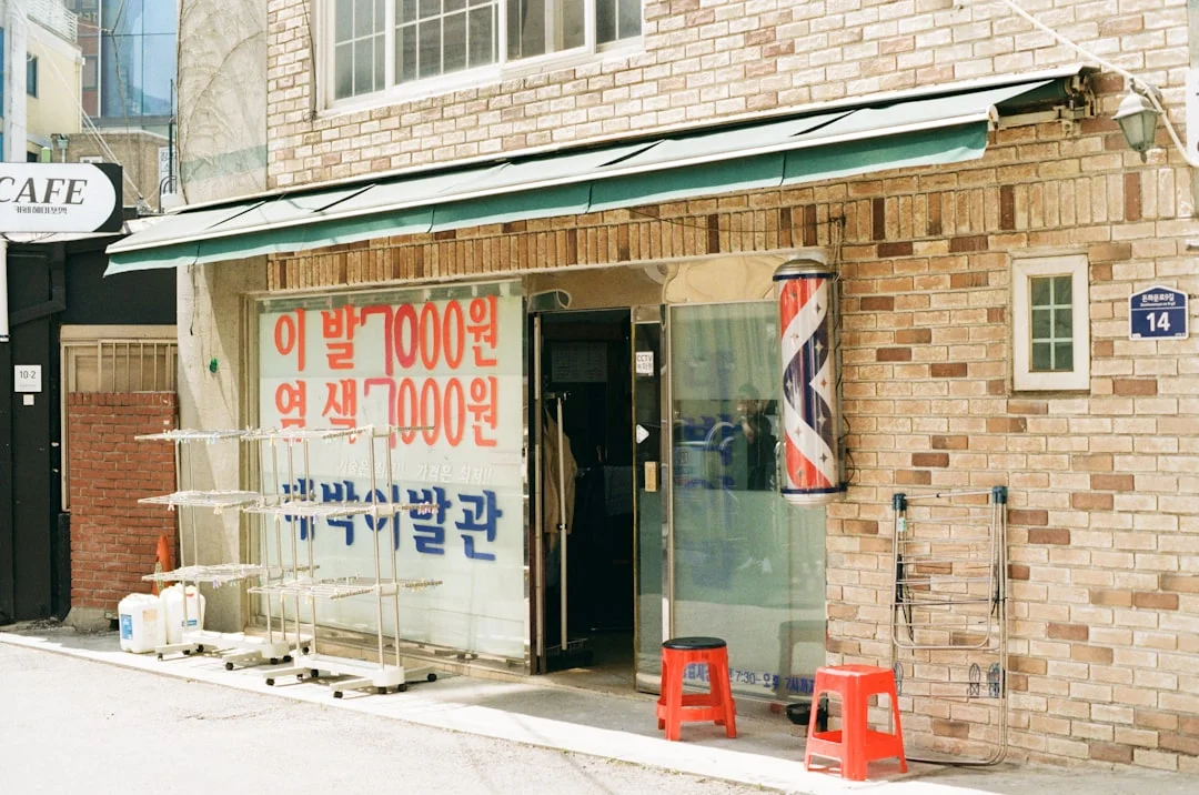A barber shop and a café in a quiet street.