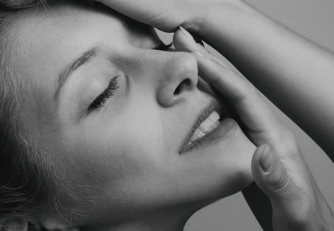 grayscale photo of womans face