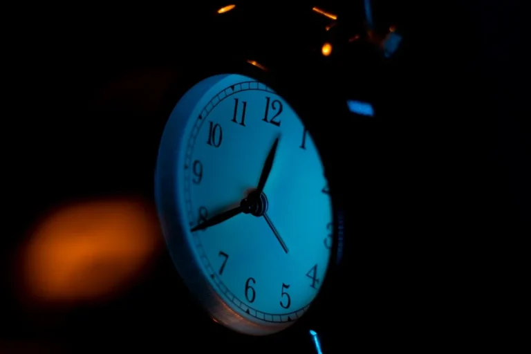 white and silver alarm clock