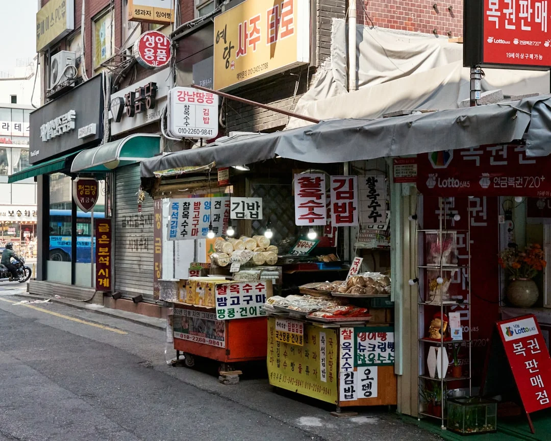 a street scene with a store on the side of the road
