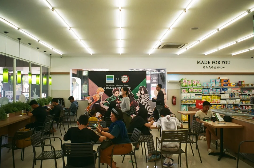 People gathered in a store with a stage display.