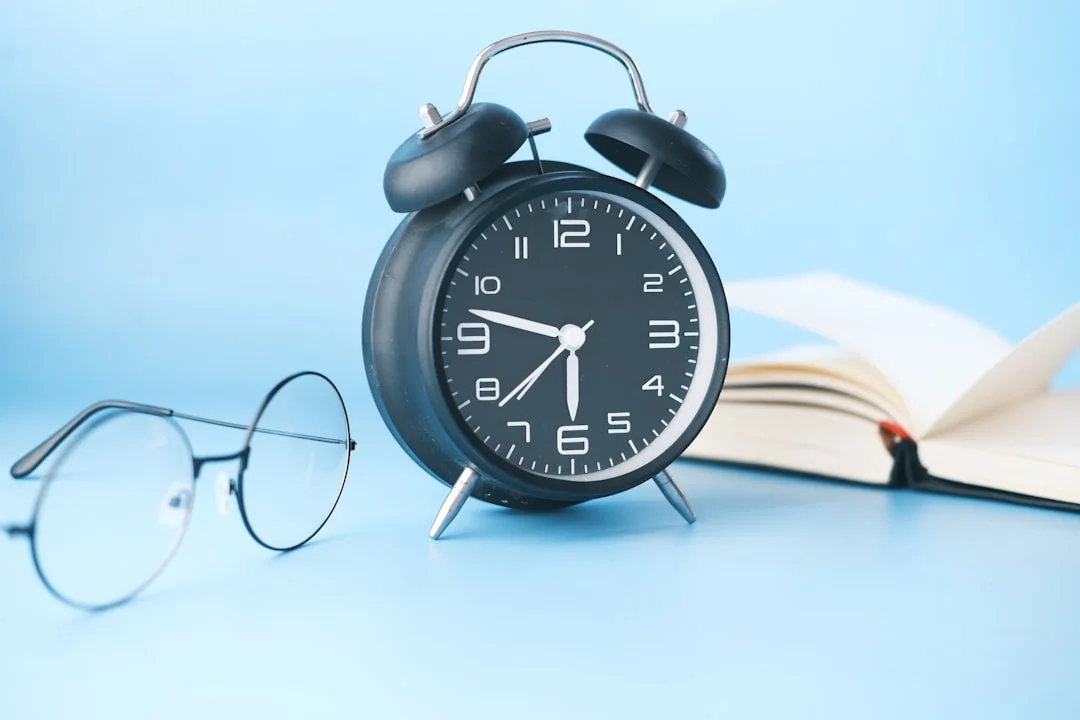 black and white alarm clock at 10 10