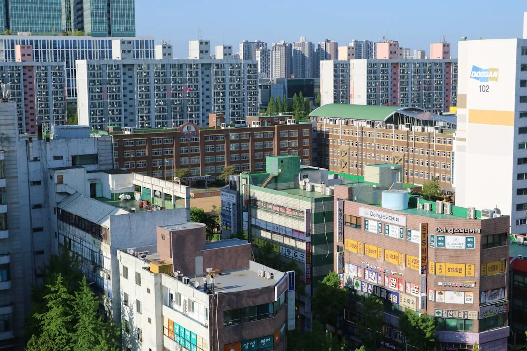 a city with lots of tall buildings and lots of trees
