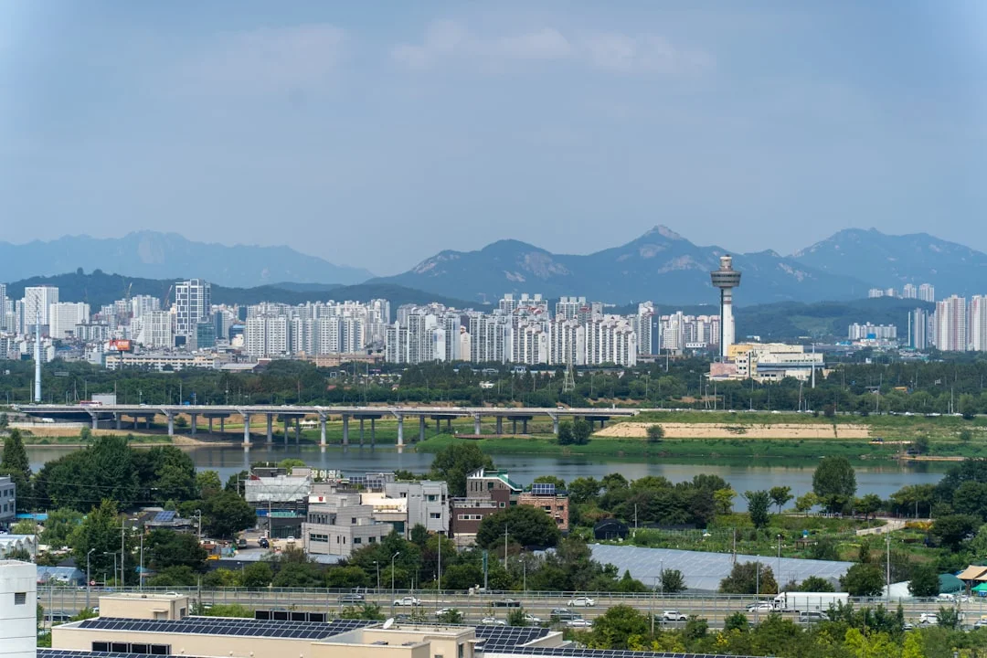 A view of a city with mountains in the background