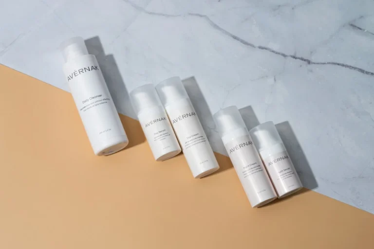 five bottles of skin care sitting on a counter