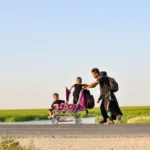 man and woman riding on bicycle during daytime