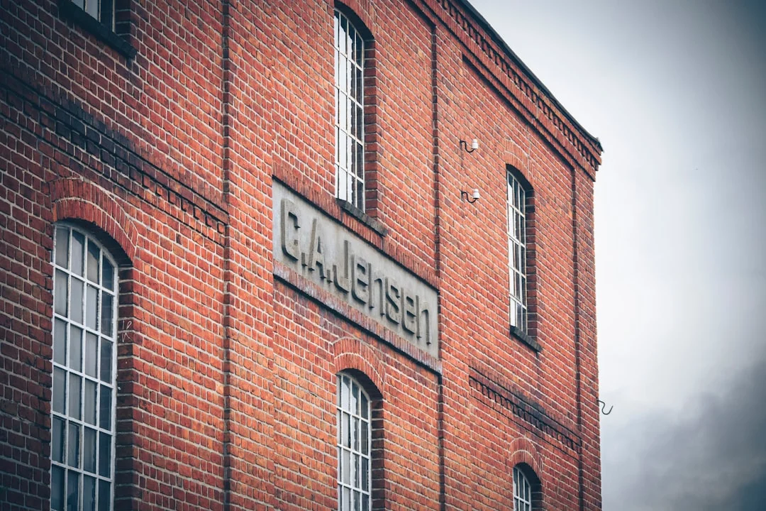 brown brick building with glass windows