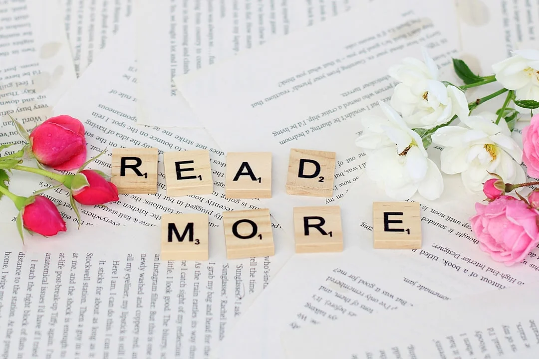 flowers and scrabbles spelling read more on top of a book
