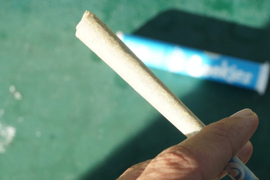 a person holding a cigarette