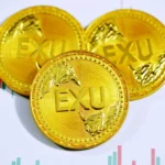 gold round coin on white surface
