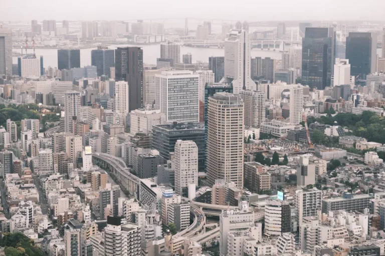 High-angle view of a dense, modern cityscape.