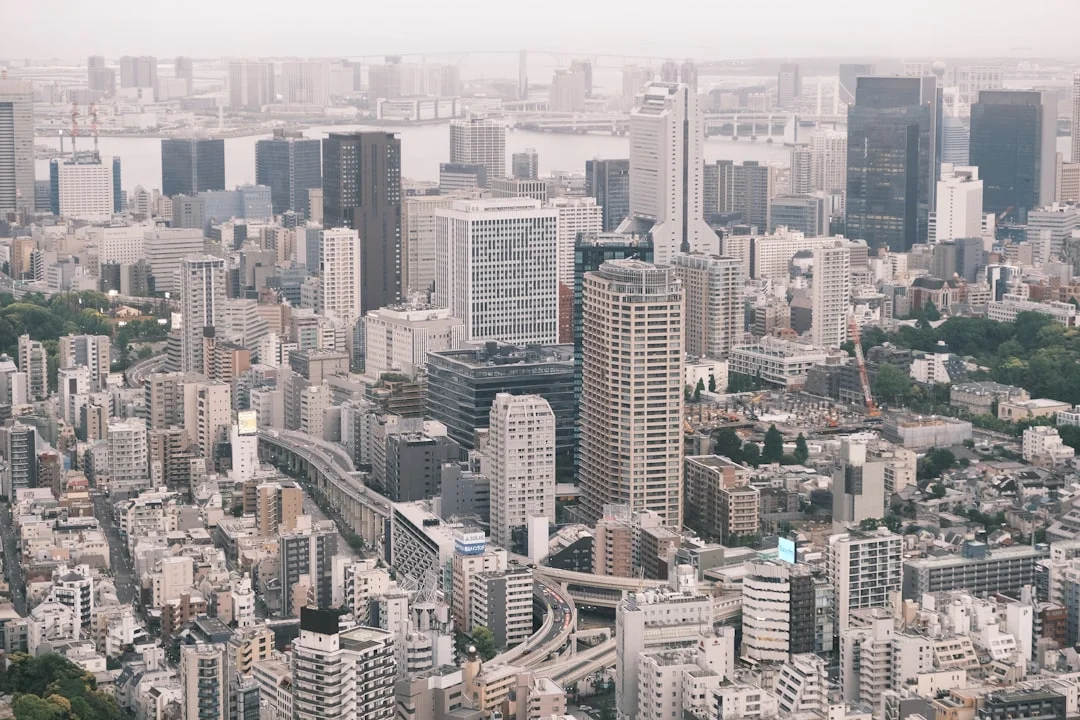High-angle view of a dense, modern cityscape.